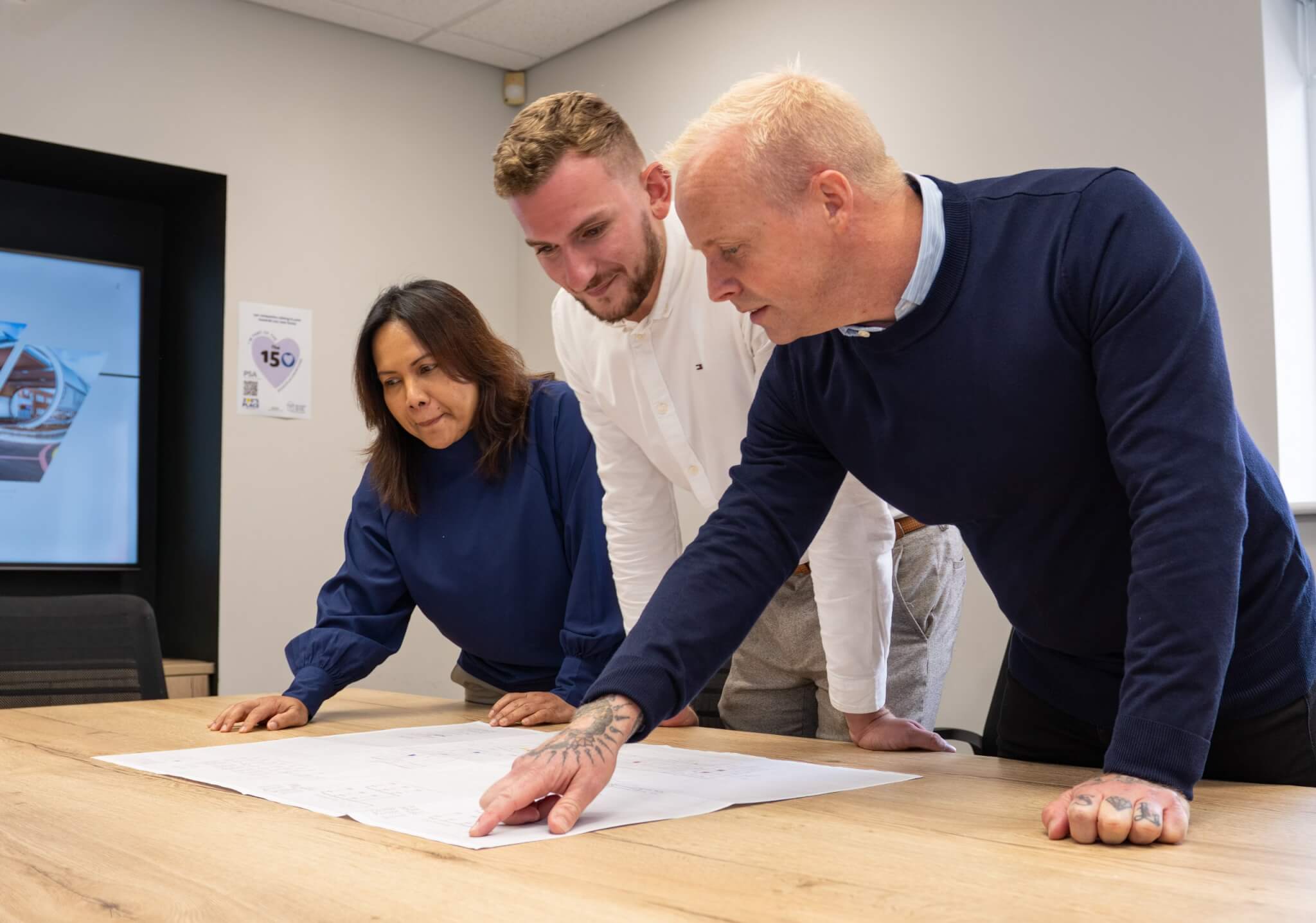 PSA Engineers discussing technical drawing for a project