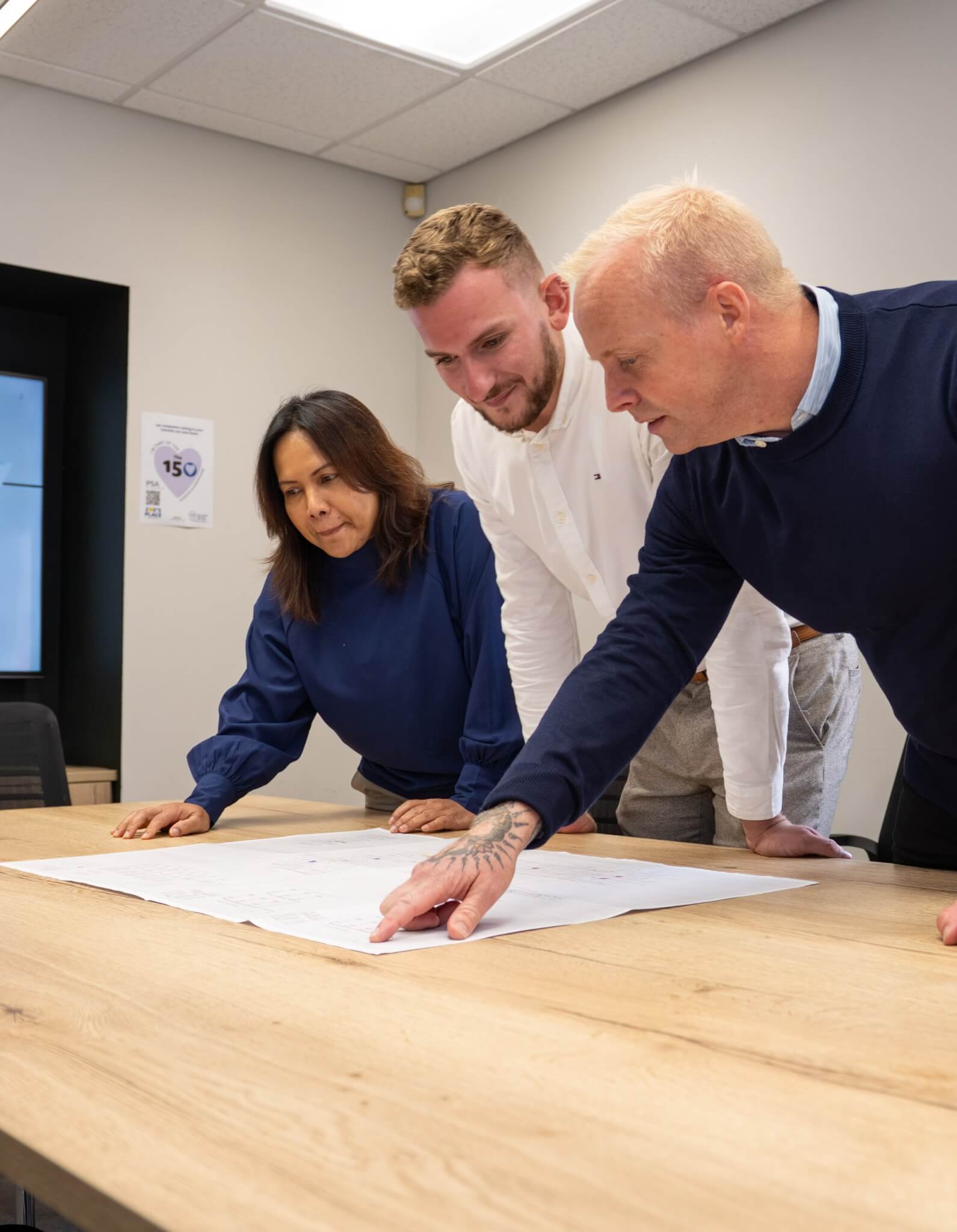 Pettit Singleton Associates engineers collaborating about a project